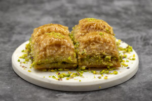 Pistachio baklava. Close-up. Traditional Middle Eastern Flavors. Traditional Turkish baklava. local name fistikli baklava